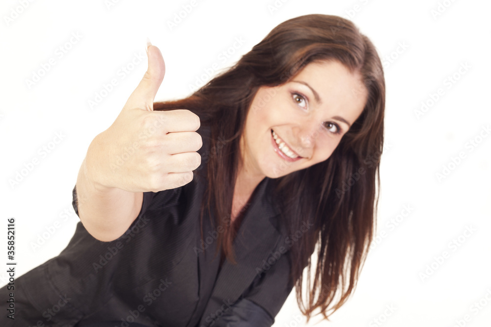 Young smiling businesswoman showing hand ok sign