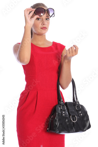 Beautiful young woman red dress in sunglasses