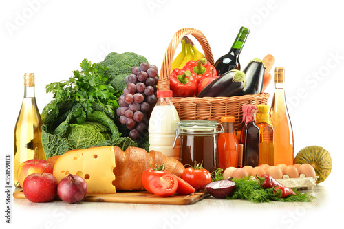 Fototapeta Naklejka Na Ścianę i Meble -  Groceries in wicker basket including vegetables and fruits