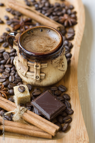 cup of coffee with spices and chocolate