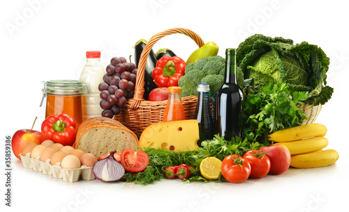 Fototapeta Naklejka Na Ścianę i Meble -  Groceries in wicker basket including vegetables and fruits