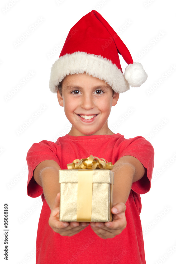 Adorable child with Santa Hat offering a gift Adorable child with Santa Hat offering a gift