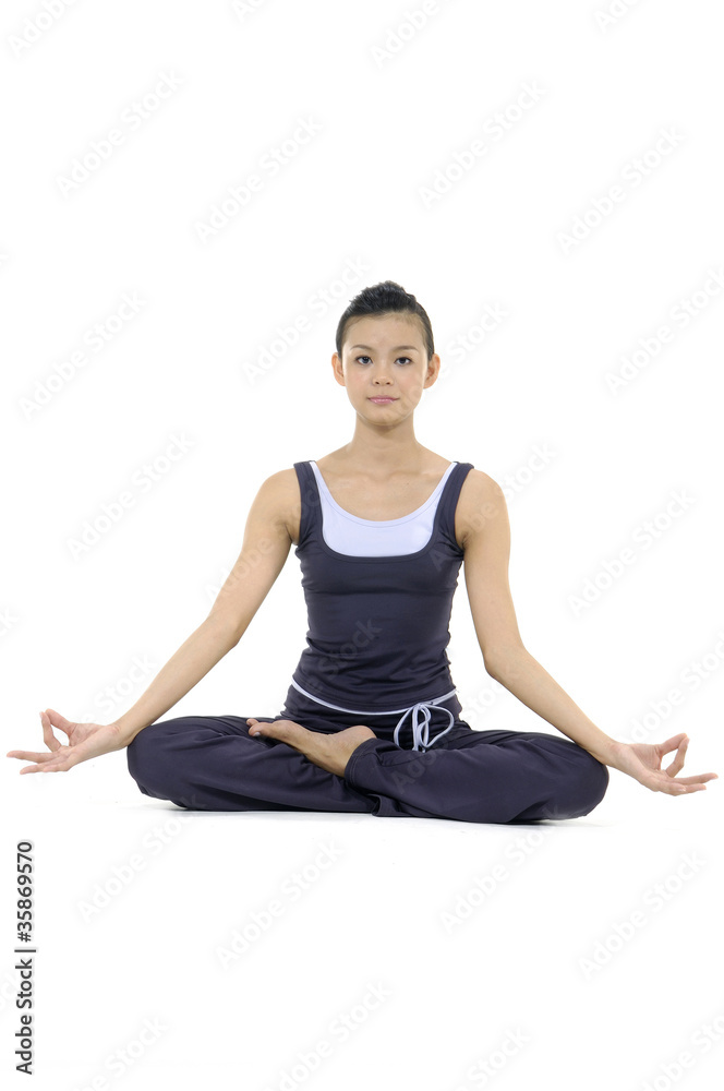 Beautiful girl practicing yoga on isolated white background
