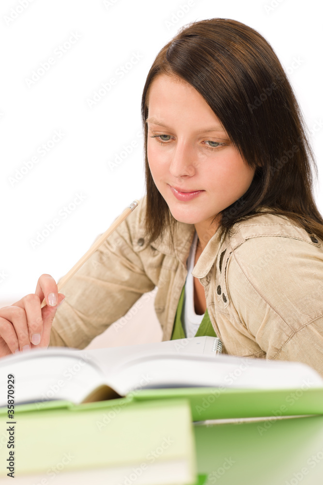 Student teenager girl write homework with book Student teenager girl write homework with book