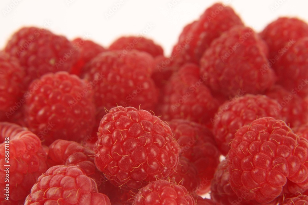 Red raspberries on white background Red raspberries on white background