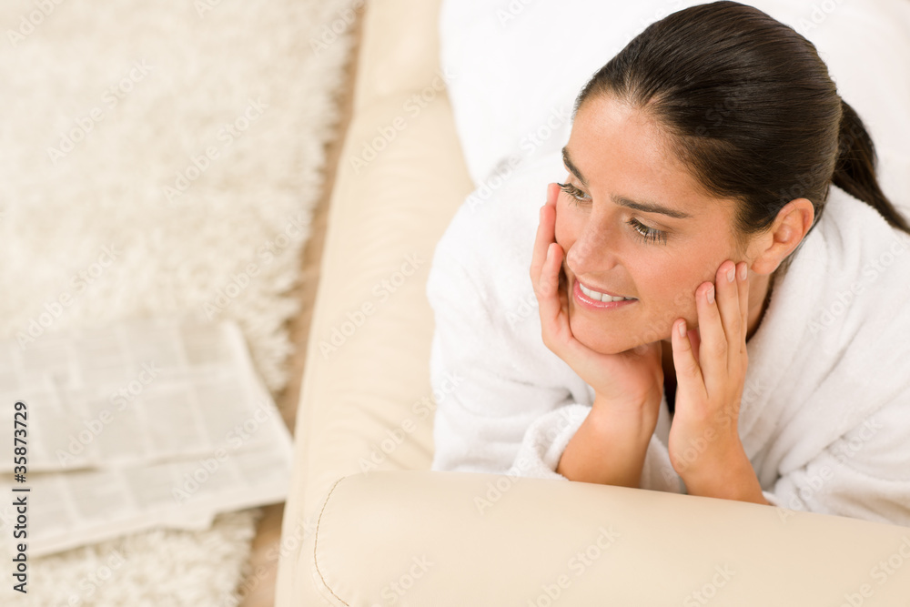Attractive woman in white bathrobe read newspapers Attractive woman in white bathrobe read newspapers