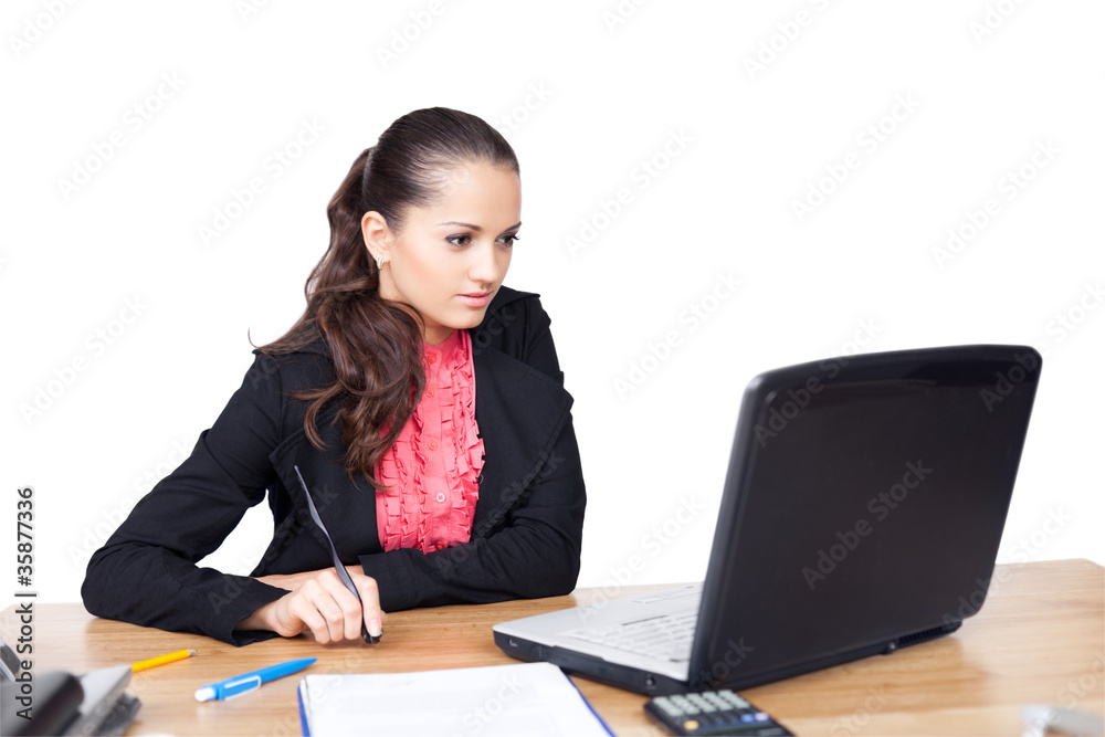 beautiful young woman sitting at office desk and working on lapt beautiful young woman sitting at office desk and working on lapt