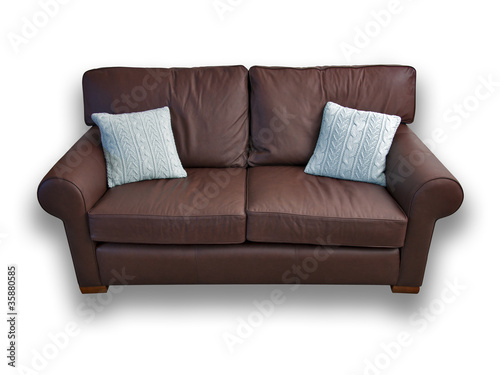 Brown leather sofa with cushions