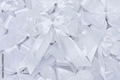 Stack of white fabric bow