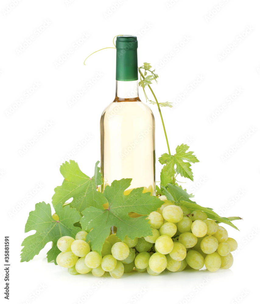 White wine bottle and grapes