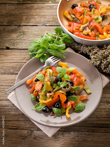 peperonata with basil and black olives photo