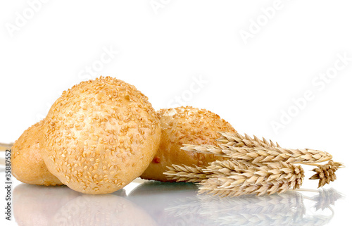 buns with sesame seeds and spikelets isolated on white