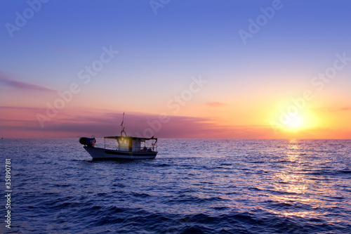 blue sea sunrise with sun in horizon