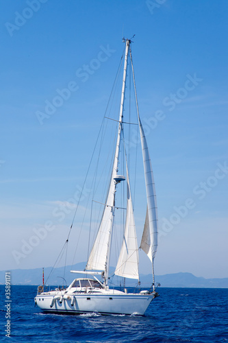 Blue Mediterranean sailboat sailing © lunamarina