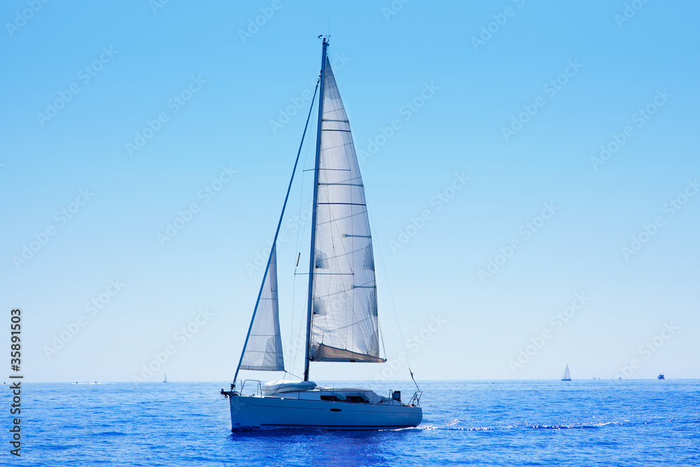 blue sailboat sailing mediterranean sea