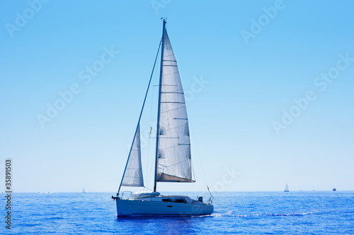blue sailboat sailing mediterranean sea © lunamarina