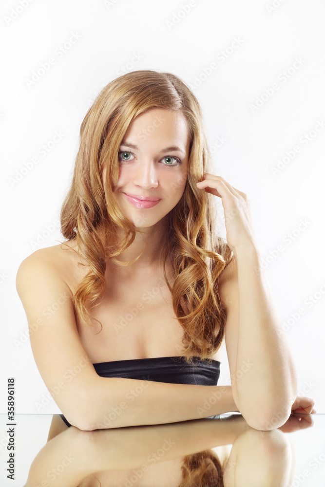 Beautiful girl with long wavy hair on gray background Beautiful girl with long wavy hair on gray background
