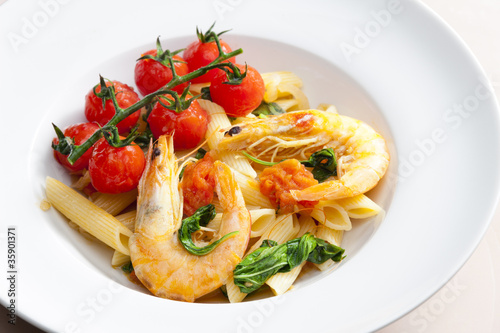 pasta penne with prawns, spinach and grilled cherry tomatoes