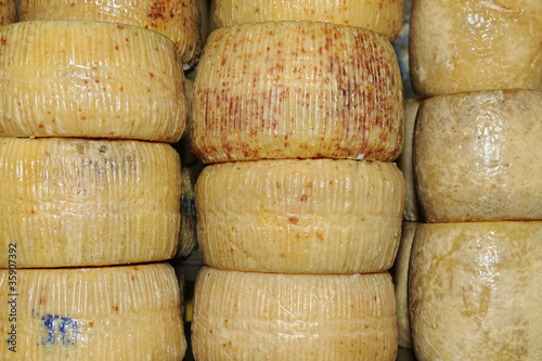 Traditional cretan graviera cheeses on sale in Chania market