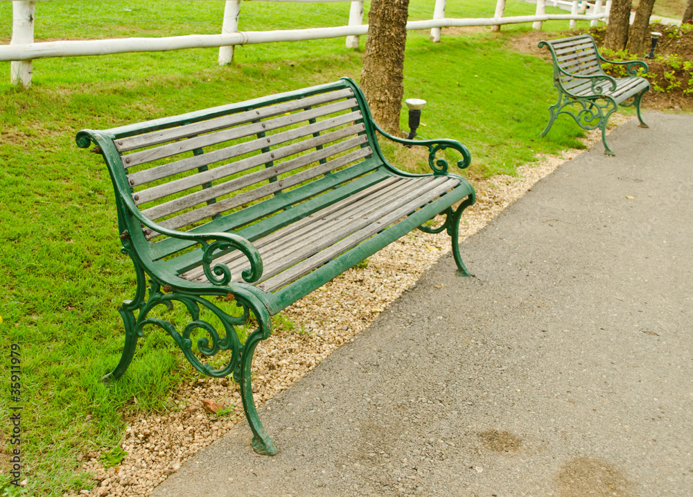 green old style arm chairs in the garden green old style arm chairs in the garden