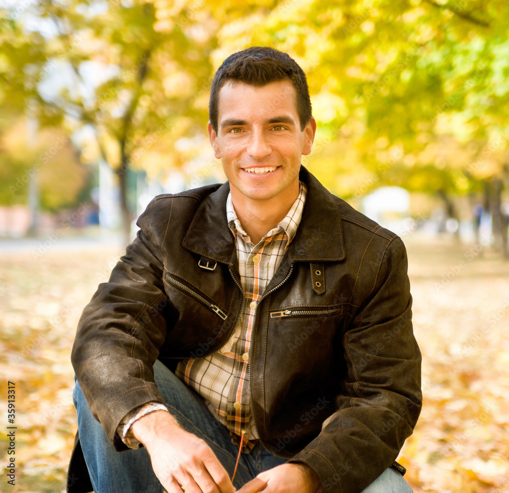 Outdoors portrait of happy young man