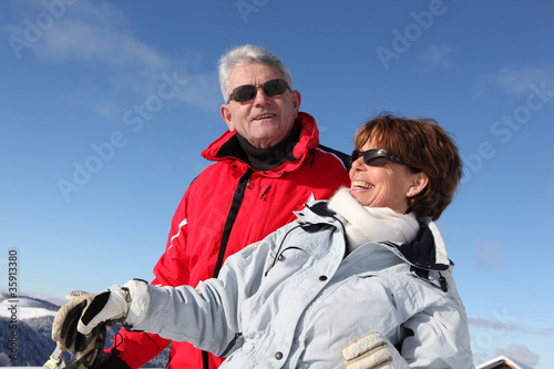 Couple skiing in the mountains