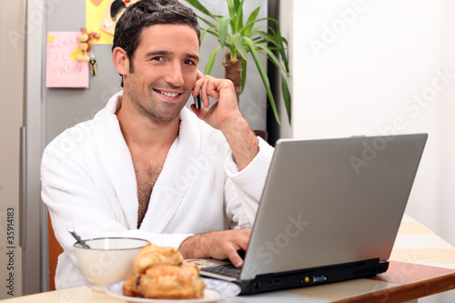 modern businessman having breakfast at home