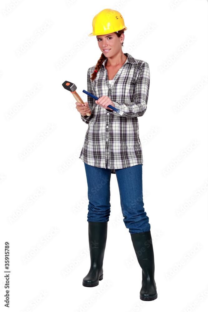 craftswoman holding a hammer and a wedge craftswoman holding a hammer and a wedge