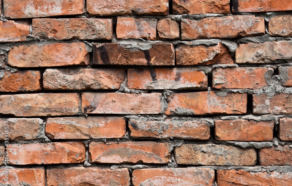 Obraz premium Abandoned brick wall background on industrial building