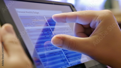 finger touching screen on tablet pc