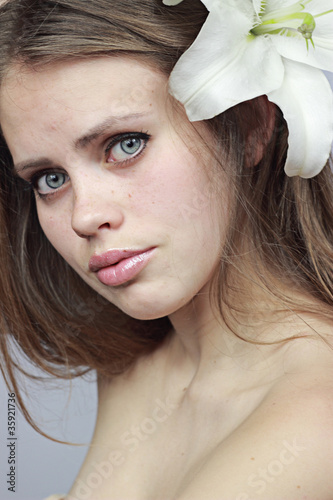 mysterious girl with a snow-white lily.