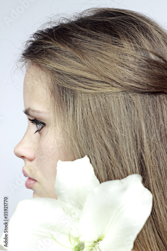 Profile the girl with a lily