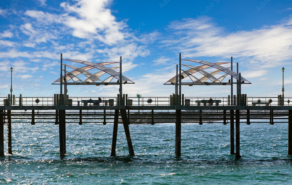 Fototapeta premium Pier with benches and lanterns