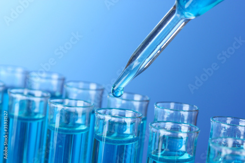 Test-tubes on blue background