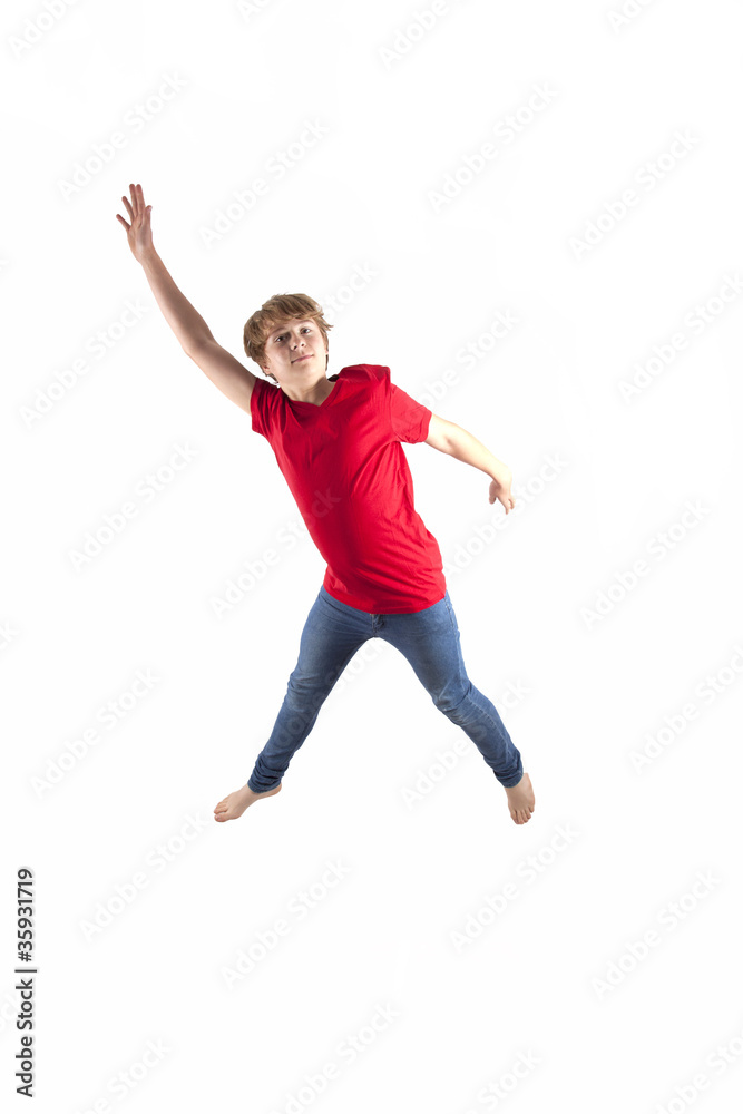 smart boy with red shirt jumping in the air smart boy with red shirt jumping in the air