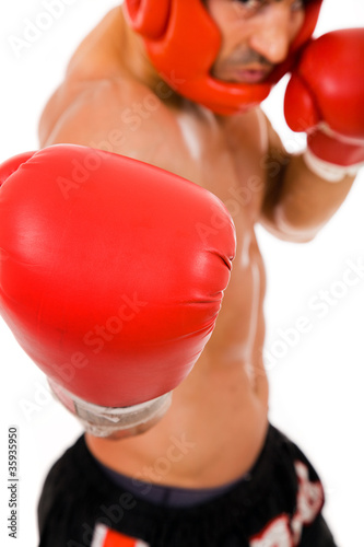 Portrait of young Boxer fighter with boxing helmet and gloves ov