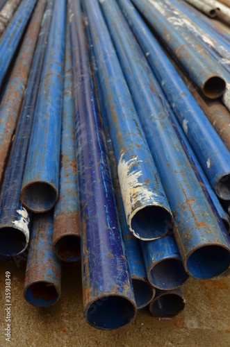 rusty blue metal pipe line