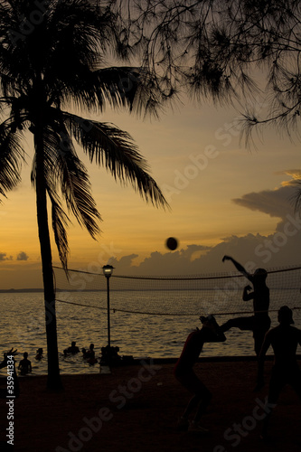 beach volleyball, sunset on the beach photo