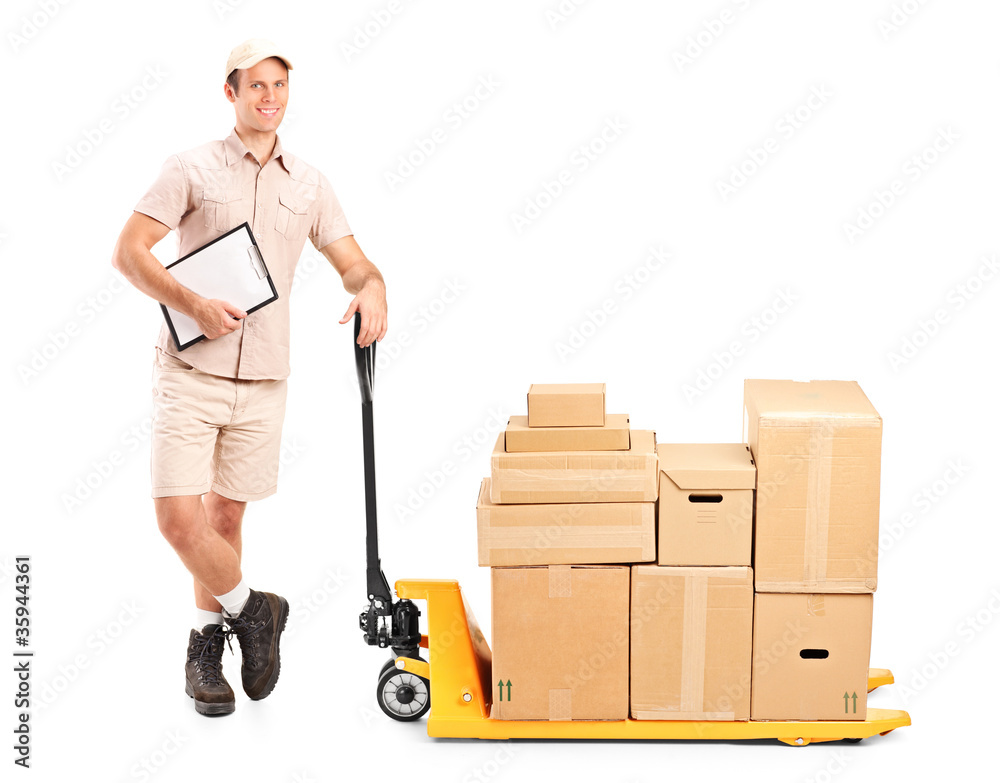 Delivery person holding a clipboard and a fork pallet truck Delivery person holding a clipboard and a fork pallet truck