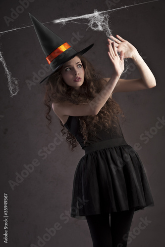 cute witch looking scared