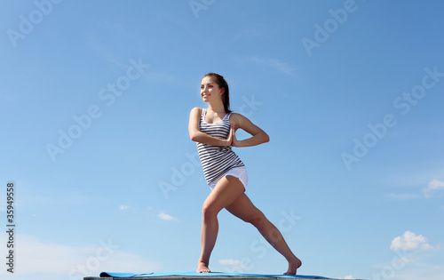 Portrait of a young woman doing exercises