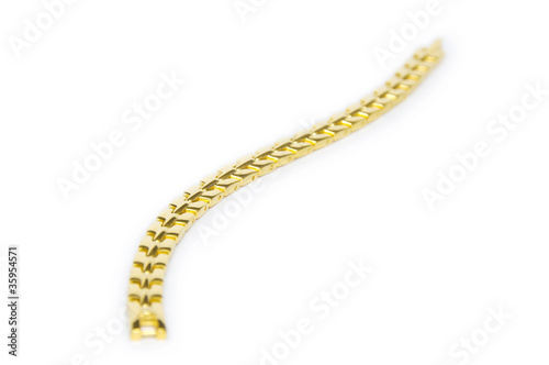 Golden bracelet isolated on white background