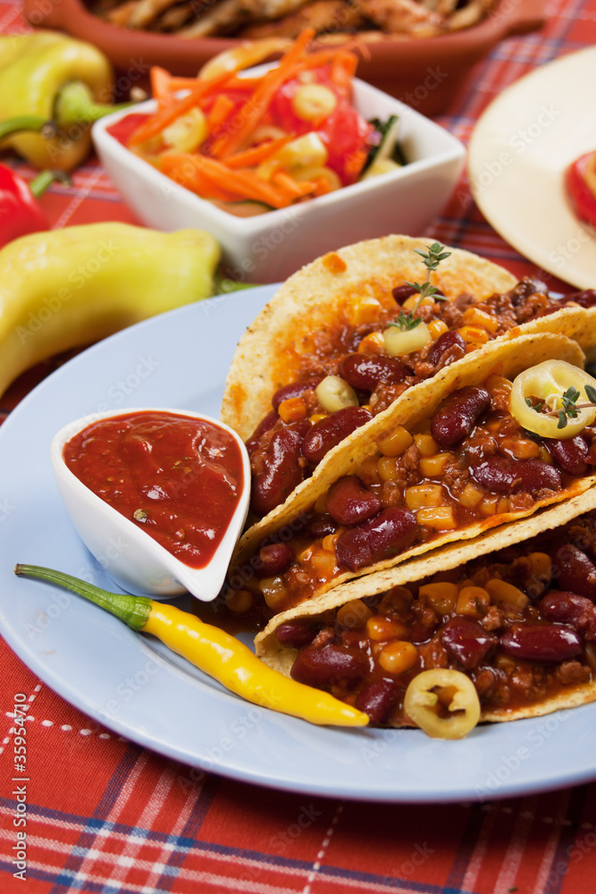 Chili con carne burrito in taco shell Chili con carne burrito in taco shell
