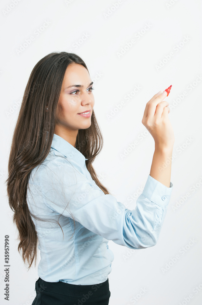 Happy smiling cheerful young business woman writing or drawing o Happy smiling cheerful young business woman writing or drawing o