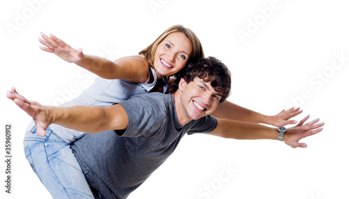 Happy couple with the hands lifted upwards