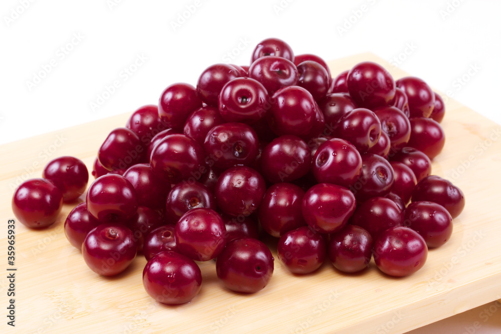 Bowl with ripe cherries. Isolated on a white background. Bowl with ripe cherries. Isolated on a white background.