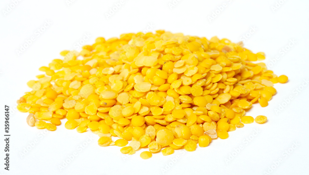 Yellow lentils isolated on white background.Macro shot Yellow lentils isolated on white background.Macro shot