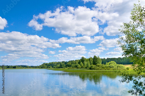 Fototapeta Naklejka Na Ścianę i Meble -  Colorful summer landscape with a lake and a beautiful sky