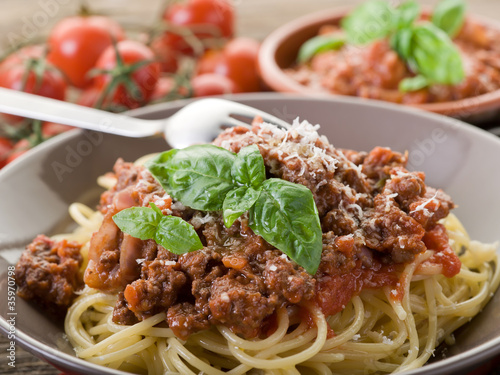 spaghetti bolognese with ragout sauce and parmesan cheese