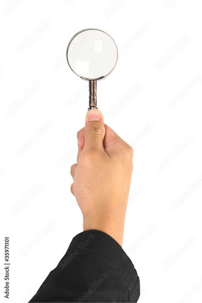Brass Magnifying glass in business hand Brass Magnifying glass in business hand